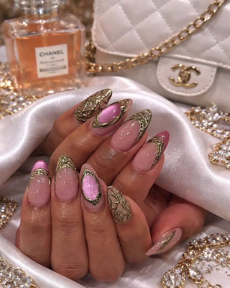Pink nails with gold filigree art and glitter detail